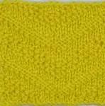 A knitted swatch of the diagnonal seed stitch pattern worked in yellow