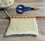 Learn how to do the Tunisian crochet knit stitch with step-by-step photos, helpful tips, and expert answers to common beginner questions.