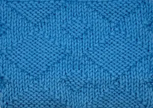 Swatch of the Giant Diamond Knit Stitch worked in blue