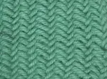 The right side of the herringbone knit stitch worked in green