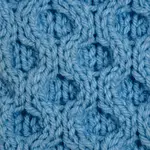 A swatch of the honeycomb cable worked in blue yarn