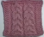 Swatch of the Knitted Horseshoe Cable Stitch Pattern, worked in pink yarn