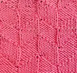 A swatch of the knit parallelogram knit stitch pattern worked in pink showing right side