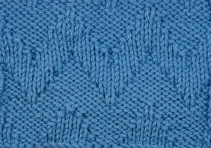The wrong side is showing of a swatch worked with the wide chevron zig zag stitch