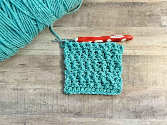 The crossed half-double crochet stitch worked in acrylic yarn The crossed half-double crochet stitch worked in acrylic yarn