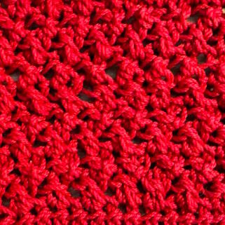 Crossed half double crochet swatch in red
