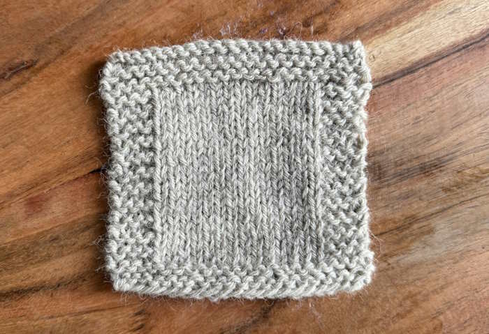 A swatch knit in Fisherman's Wool in a grey color A swatch knit in Fisherman's Wool in a grey color