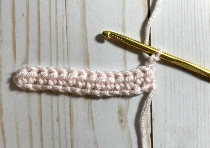 Half double crochet post stitch step by step directions for working through the back post