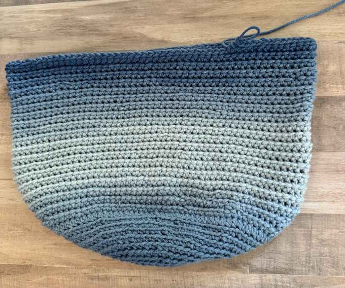 Crochet Market bag in progress showing the ombre yarn and linked half double crochet stitch. Crochet Market bag in progress showing the ombre yarn and linked half double crochet stitch.