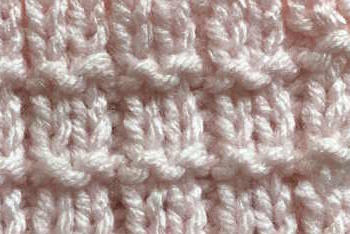 The knit pique stitch pattern closeup view The knit pique stitch pattern closeup view