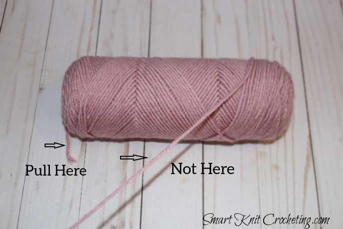 Pull the end of the yarn from the inside center of the skein rather than the end on the outside. Pull the end of the yarn from the inside center of the skein rather than the end on the outside.
