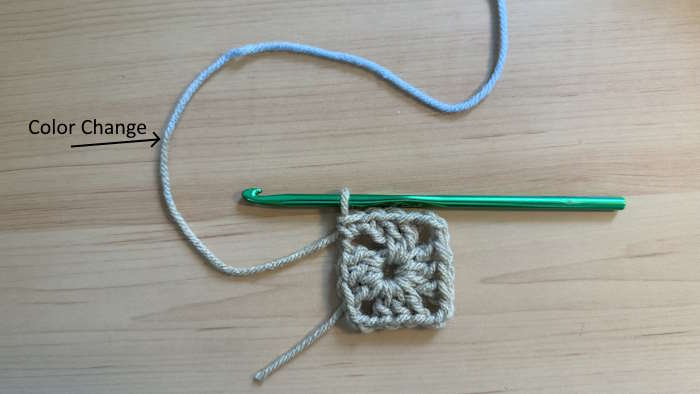 Beginning of a granny square using Red Heart Granny Square Yarn with a mistake