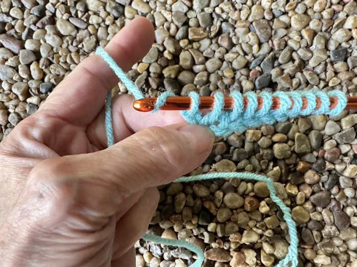 Shown is the return pass for the Tunisian crochet knit stitch Shown is the return pass for the Tunisian crochet knit stitch