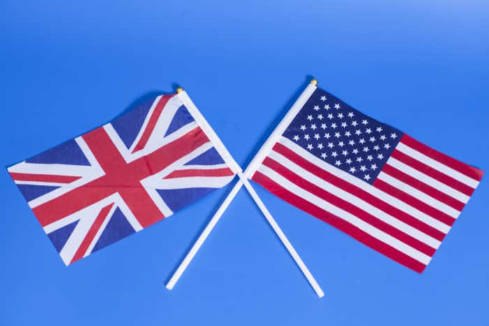 US and UK flags on a blue background