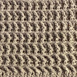 waffle stitch crochet closeup worked in taupe yarn