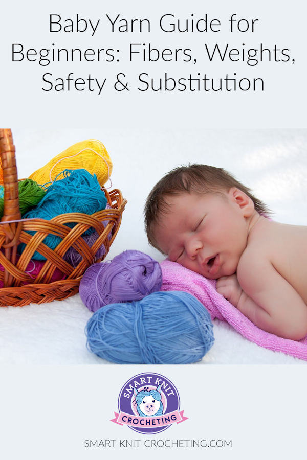A baby is sleeping surrounded by skeins of baby yarn.