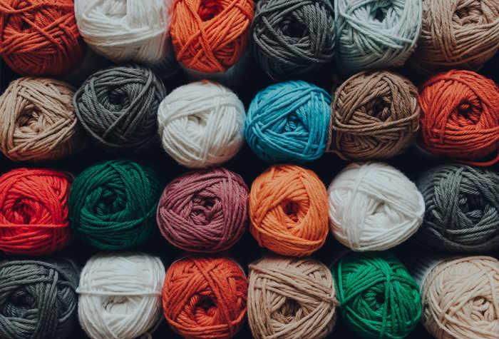 A large assortment of yarn in many different colors