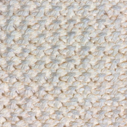 A swatch of the knit Bamboo stitch show the wrong side of the fabric done in beige