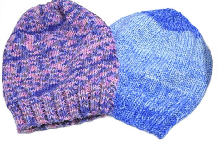 Two beanies worked in varigated yarn