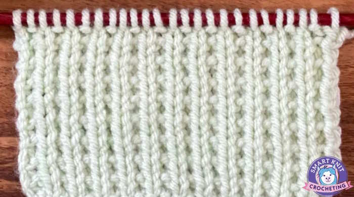 Broken rib knit stitch showing sides of the swatch worked on an odd number of stitches