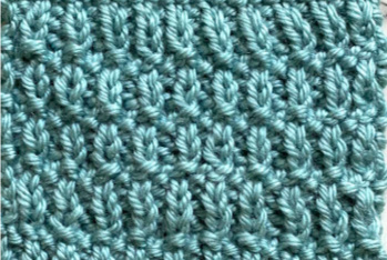Knit bumpy stitch pattern worked in teal