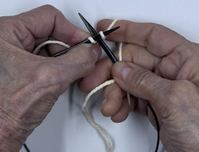 Insert right needle between stitches on the left needle