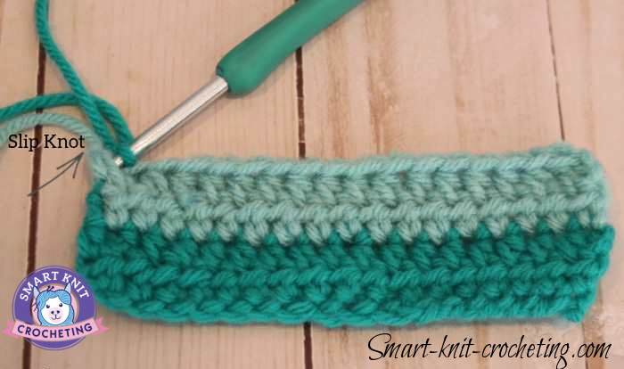 How to change colors in crochet:  one method is to pick up the new color at the beginning of the row.