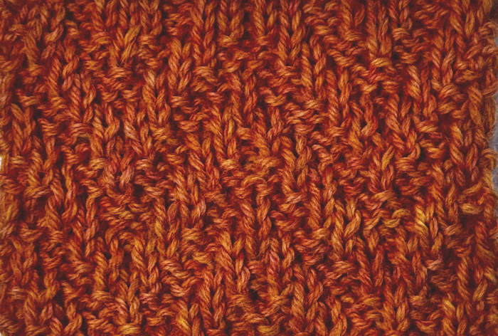 The Chevron rib stitch swatch worked in orange 