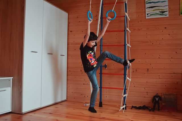 A Young boy is exercising