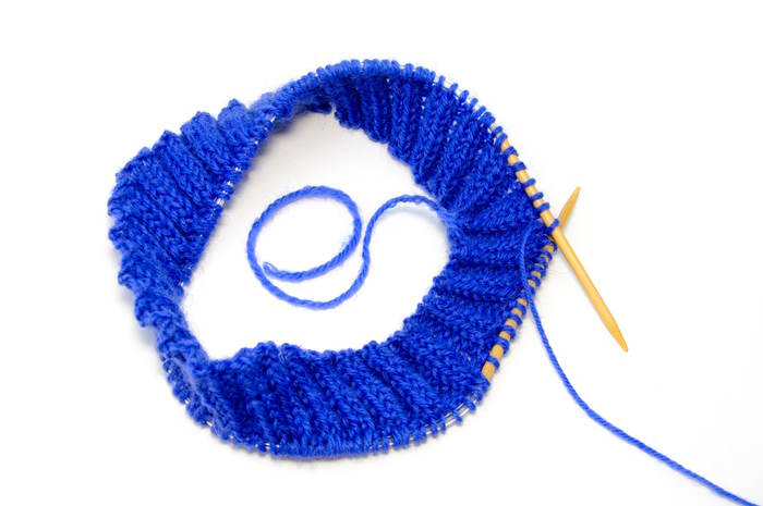 Use a pair of circular knitting needles to create round knit work.