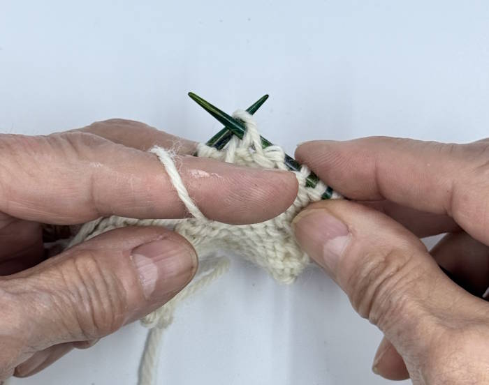 step two for knitting the purl stitch with the continental method step two for knitting the purl stitch with the continental method