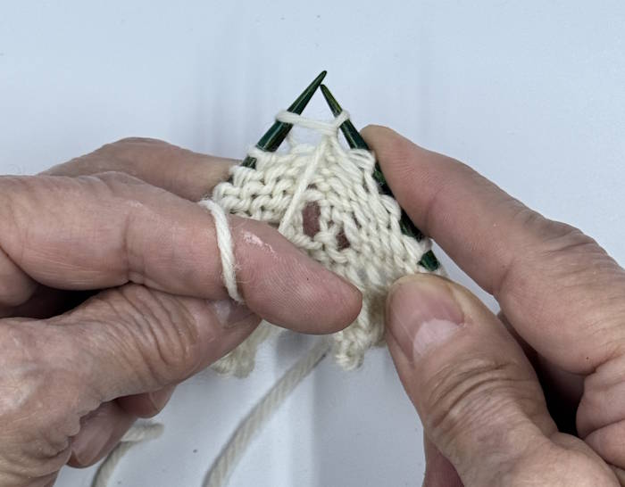 step 3 for knitting the purl stitch, continental style step 3 for knitting the purl stitch, continental style