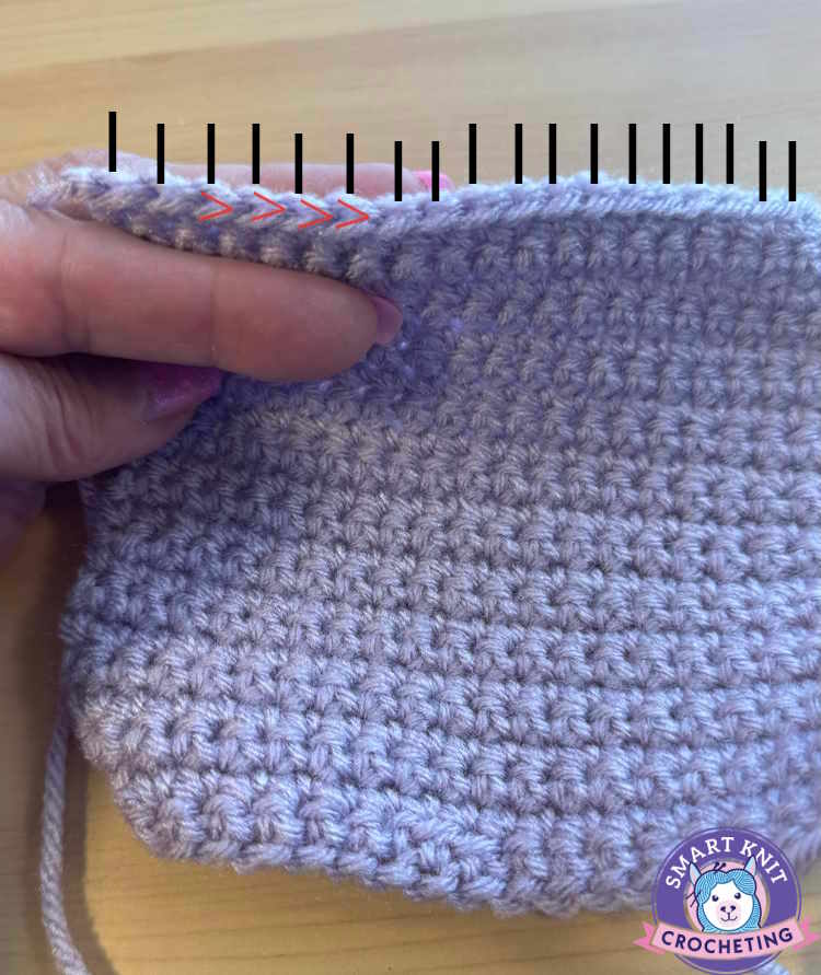 a crochet swatch of single crochet marked up to show how to count the stitches a crochet swatch of single crochet marked up to show how to count the stitches