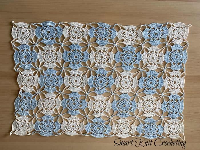 An antique crochet doily made in the 1950s by connecting small crochet motifs
