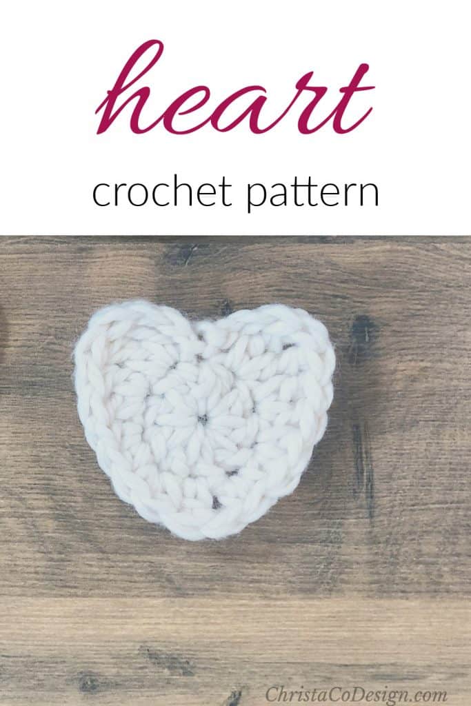crocheted heart shape worked in white yarn crocheted heart shape worked in white yarn