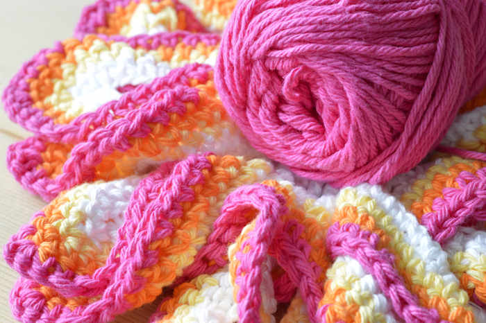 A crochet hook shown working varigated yarn  A crochet hook shown working varigated yarn