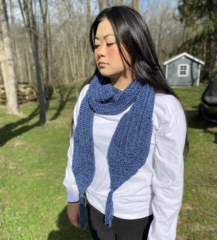 Double crochet stitch scarf modeled by an Asian American Double crochet stitch scarf modeled by an Asian American