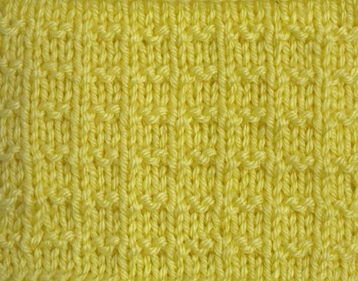 A swatch of the double alternate andalou stitch worked in yellow