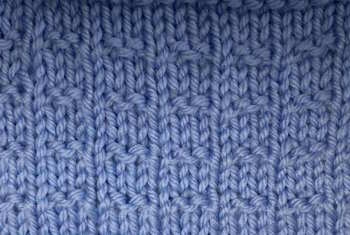 A thumbnail image of the Double Andalusian knit stitch worked in blue yarn