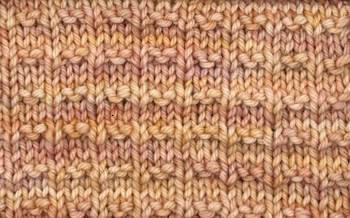 A thumbnail image of the Double Andalusian knit stitch worked in blue yarn