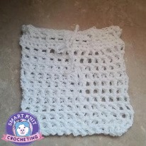 Double Crochet Mesh Produce Bag crocheted with white yarn.