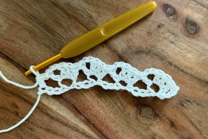 The Crochet Drunken Granny Stitch: Row One The first row of the Drunken Granny Stitch worked in white cotton  yarn