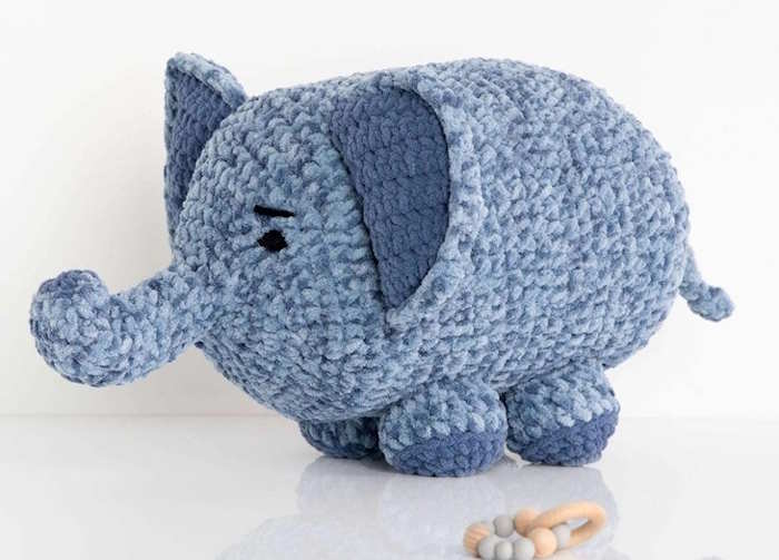 A crocheted toy elephant worked in blue yarn