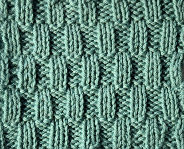 The wrong side showing of the elongated rib stitch