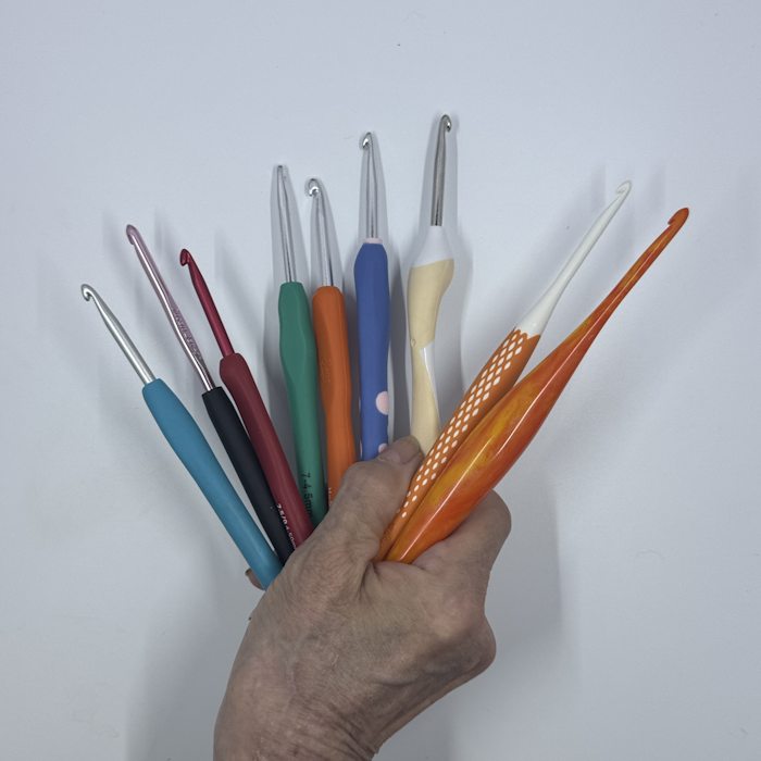 All nine ergonomic crochet hooks reviewed on this page held in one hand All nine ergonomic crochet hooks reviewed on this page held in one hand