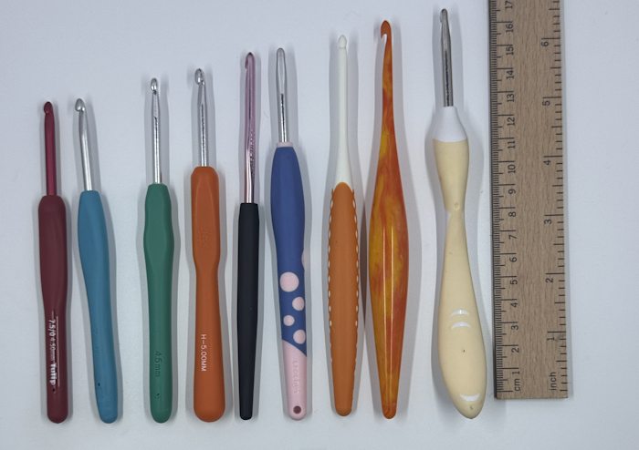 All nine ergonomic crochet hooks lined up by length All nine ergonomic crochet hooks lined up by length