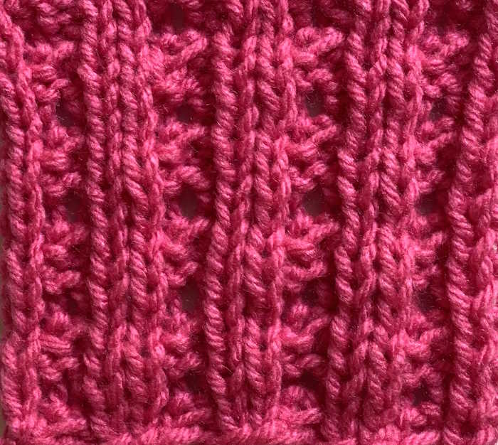 Eyelet mock cable rib swatch showing the wrong side Eyelet mock cable rib swatch showing the wrong side