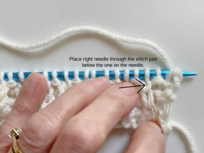 Photo showing where to place the knitting needle when making the Fisherman's Rib (K1B)