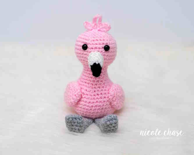 A toy flamingo crocheted in pink yarn