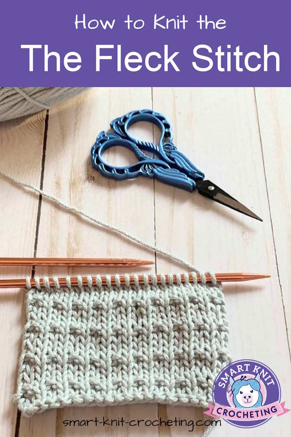 A swatch of the knit fleck stitch still on the needles in a pin image